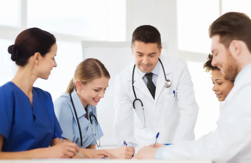 Group of doctors meeting and taking notes